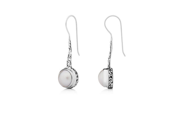 Silver earrings dominate the jewellery